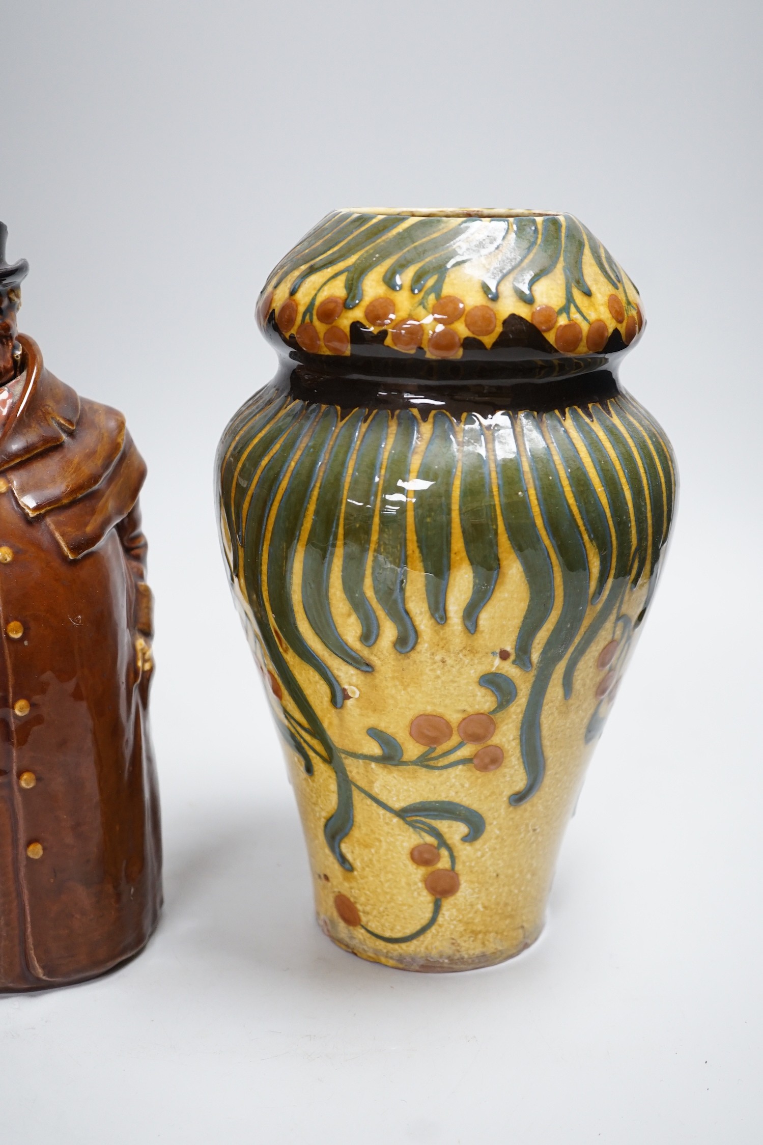 A Wileman & Co Faience vase and a Doulton Pickwick decanter, tallest 27cm